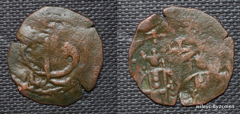 Ivan Alexander and son Mikhail 1331-1355 CE Copper
Obverse: King Alexander at left and Mikhail rt. At their heads are the same monograms 46, below the
right hand of king Alexander monogram 46.
Reverse: Monogram 47?
18mm, 1.09
Moushman LXIV.14-17
