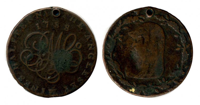 Anglesey Mines 
Halfpenny token coin of the Parys Mine Company, Anglesey. 1788.

Reverse: "P M Co." in monogramme , encircled by legend THE ANGLESEY MINES - HALFPENNY. Dated 1788.
Obverse: Druid within wreath with acorns.

Holed.
Keywords: conder token