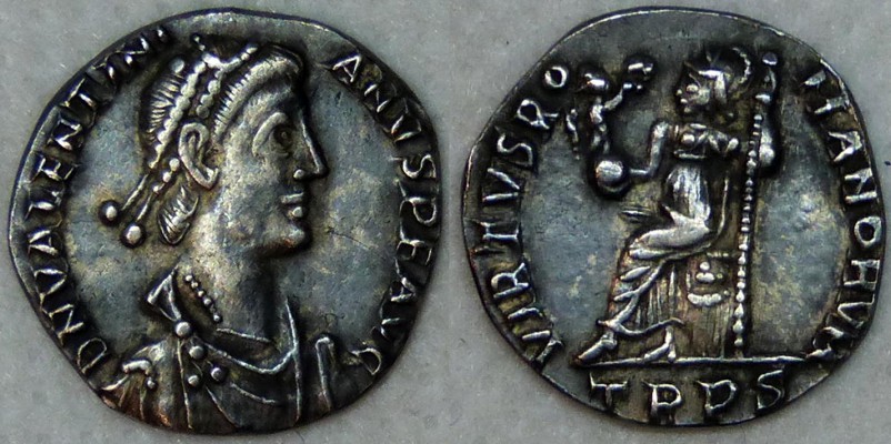 <!--E4-->RIC.67a1 Valentinian II (AE4, Salvs Reipvblicae)
Valentinian II, western roman emperor (375-392)
Nummus AE4: Salvs Reipvblicae (383-392, Antioche, 1st officine)

bronze, 12 mm diameter, 1.51 g, die axis: 6 h,

D N VALENTINI-ANVS P F AVG; pearl diademed, draped & cuirassed bust right
R/ VIRTVS RO-MANORVM  / TRPS in exergue; Roma seating left on cuirass, holding globe and spear

Keywords: Valentinian II treves siliqua