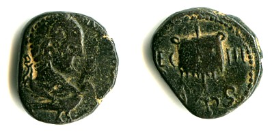 Rhesaina (Mesopotamia) - Third Legion Parthica
Illegible circular legend. Naked bust of a laureate emperor upon eagle.
LEG. III , Vexillum (maybe with the letter Γ on it).

These small coins issued by the IIIrd Legion usually come from Rhesaina (Ras el-Ayn, at the source of the river Khabur, nowat the Syro-Turkish border). The obverse looks like it is Caracalla, but also like a consecration portrait.
Keywords: Rhesaina Legio_Tertia_Parthica vexillum