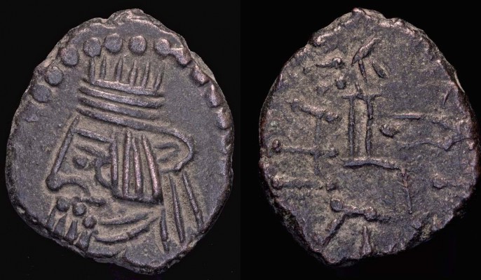 Parthia -- Artabanos II.,  10 - ca 40 AD
AE dr.,  3,48g,  19,33mm;
Sellw.  - ,  Shore  - ,  Sunrise  - ;
mint:  Eastern,  axis:  12h;
obv.:  bare-headed, left, w/broad diadem, 2 loops, and 2 ribbons;  medium-long straight hair, mustache, chin beard (hair ends as dots);  earring, two-layer necklace;  dotted border 9-15h;
rev.:  archer, right, seated (is the &#960; the throne or the monogram for Margiane?), w/bow;  corrupted legend.
